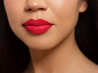 Closeup plump Lips. Lip Care, Fillers. Macro photo with Face detail. Natural shape with perfect contour. Close-up perfect red lip makeup beautiful female mouth. Plump sexy full red lips