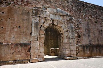 urban gate in the medieval town of spello umbria