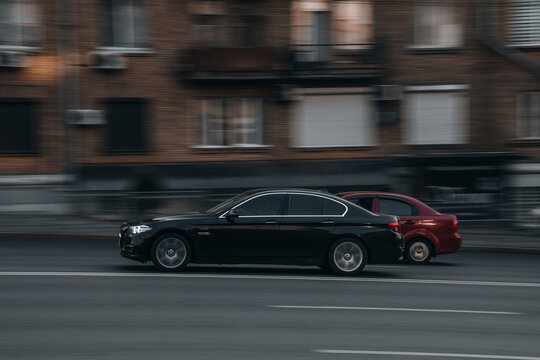 Ukraine, Kyiv - 16 July 2021: Black BMW 5 Series car moving on the street. Editorial