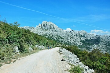 Croatia-view of the tourists and rocky city of Tulove Grede in the Velebit National Park