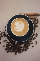 a hot cappuccino with latte art while enjoy at cafe