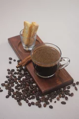 Fotobehang a perfect black coffee or kopi tubruk in Indonesian name which coming out with coffee flavor  © ILHAM_PS