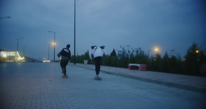 Skateboarders Skate Down The Hill From The Suli Skate Park in Sulaymaniyah, Iraq