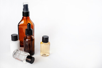 Brown and transparent bottle for liquid cosmetic serum. space for text