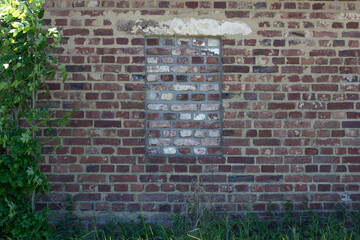 an old building in the forest with bricked up windows