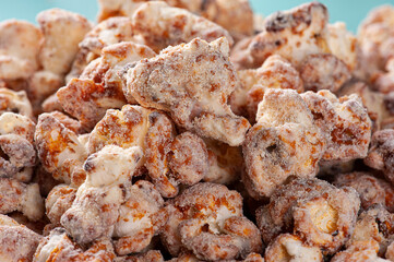 Gourmet sweet popcorn in close-up photo. Caramel flavor. Top view