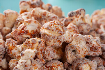 Gourmet sweet popcorn in close-up photo. Caramel flavor. Top view
