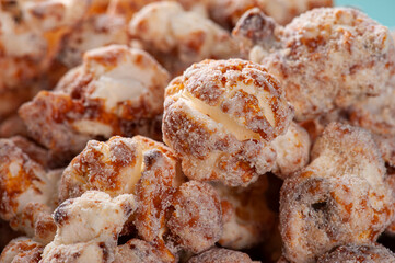 Gourmet sweet popcorn in close-up photo. Caramel flavor. Top view