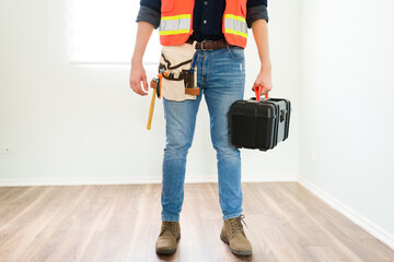 Close up of a carpenter carrying his tools
