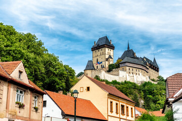 Obraz premium Village of Karlstejn village and Karlstejn Castle. Central Bohemia, Czech Republic