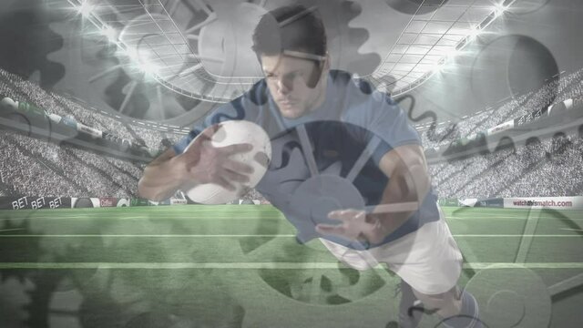 Animation of cogs turning over rugby player during rugby match in sports stadium