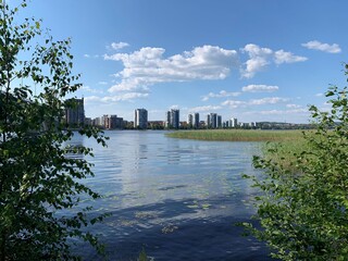 View over the lake to an urban town district. Living in a modern apartment close to the nature, services and city center. The photo is taken in Jyväskylä, Finland.