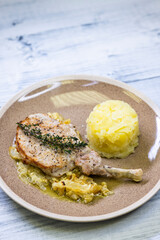 pork chop with thyme baked on creamy onion with mashed potatoes