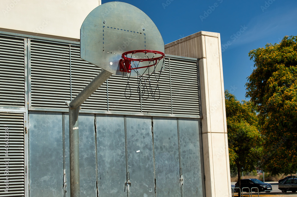 Wall mural metal basketball hoop on street court