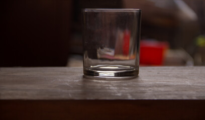 empty alcohol glass on wooden table