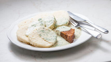 beef meat with dill sauce and dumplings