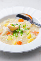 cauliflower soup with carrot, potatoes and poache egg
