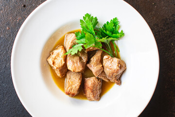 stewed meat ragout roast pork, lamb or turkey nutritious food organic products meal snack copy space food background rustic. top view keto or paleo diet