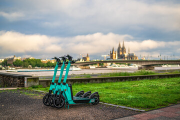 E-scooters on Cologne's Rhine promenade, Germany.