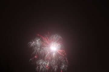 Small fireworks in the black night sky