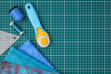 Home craft concept photo - patchwork  or quilt  tools and textile set flatlay.