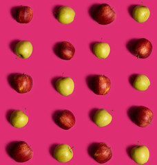 Green and Red apple pattern on a pink background