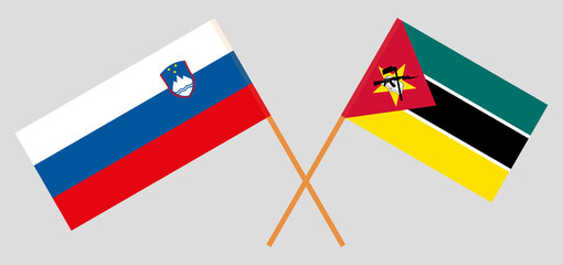 Crossed flags of Slovenia and Mozambique. Official colors. Correct proportion