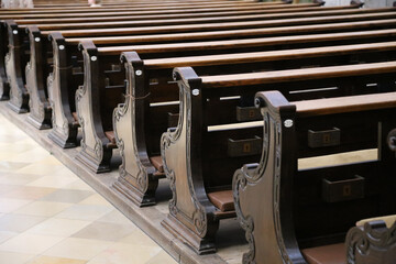 Closeup of brown wooden pews