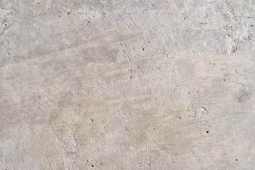the gray texture of the concrete is smooth with scratches