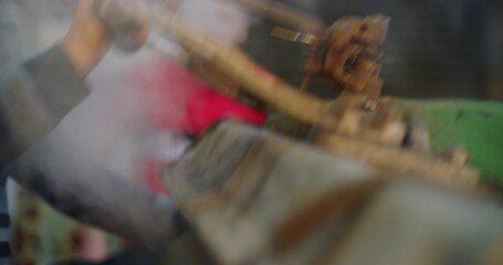 Traditional Steam Press Iron On Suit Jackets At The Grand Bazaar in Erbil, Iraq