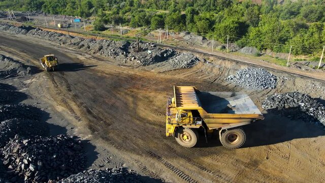 quarry truck transport of stone ore loading transportation overflying drone quarry