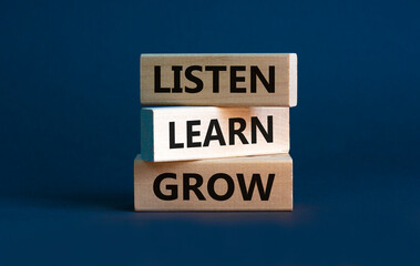 Listen, learn and grow symbol. Wooden blocks with concept words listen, learn, grow. Beautiful grey...
