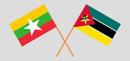 Crossed flags of Myanmar and Mozambique. Official colors. Correct proportion