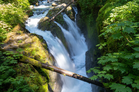 Sol Duc Falls waterfall, daytime long exposure, with silky water, taken on a sunny day in Olympic National Park