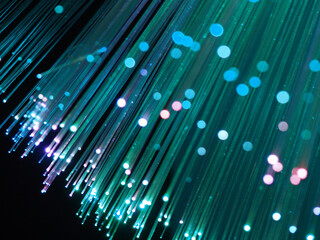 Close up fiber optic lamp, colored optical fibers, green lights at night, party futuristic neon color style, new retro, colored lights