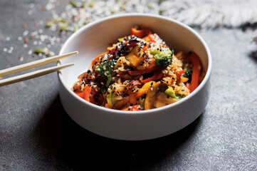 Japanese rice salad with sesame seeds, chicken and vegetables.