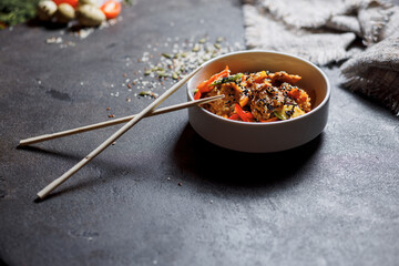 Japanese rice salad with sesame seeds, chicken and vegetables.
