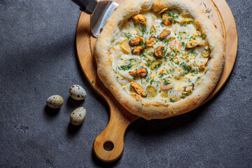 Pizza with bacon, tomatoes, cheese and olives. Italian Cuisine.