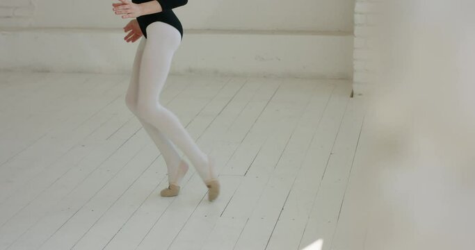 Teen girl wearing black leotard dancing. Young dedicated dancer having a practice session - childhood dream, arts 4k footage