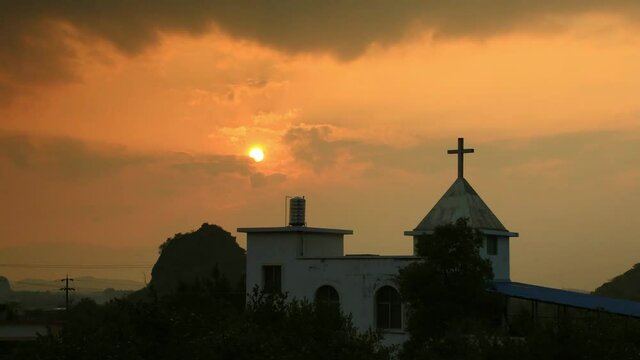 Time-lapse shot of sunset near a church
