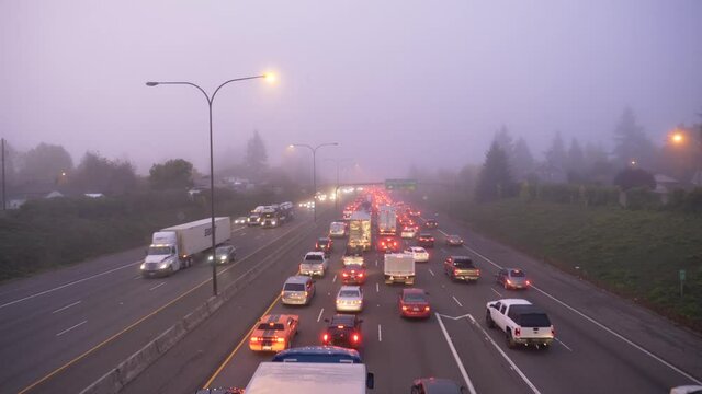 Foggy Morning Traffic Jam on Interstate Freeway 