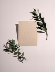 This is a mockup of summer wedding stationery. Plain brown greeting cards and invitations on beige...