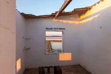 White house with message Follow yours Dreams, in Las Salinas in Formentera in 2021.