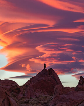 Beautiful Sierra Wave of California sunset with orange lenticular clouds burning in the sky