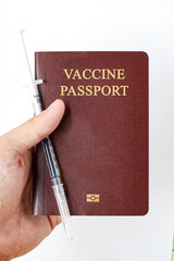 Vaccine passport with medical syringe needle dose with drug. Vaccination passport is concept of immune travel to protect from Covid-19 virus pandemic on white background