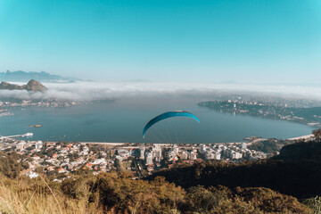 Paraglider in Niteroi City Park on a sunny but foggy weather