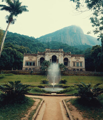 Natural view of the Parque Lage in Rio de Janeiro, Brazil with a fountain in the foreground