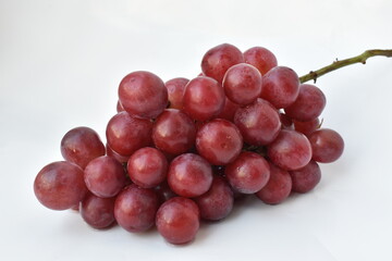 red grapes on a white background