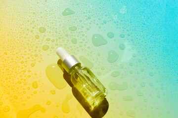 Dropper glass bottles with pipette. Transparent hyaluronic natural beauty mineral product and eco serum skin care concept. Top horizontal view copyspace. Summer juicy colors