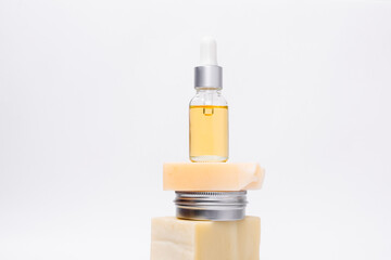 Zero waste greenwashing shampoo and mineral oil serum. Skin and hair care concept. Sustainable reusable vegan shampoo bar.